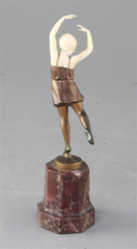 An Art Deco ivory and cold patinated bronze figure of a dancing girl, height 7in.